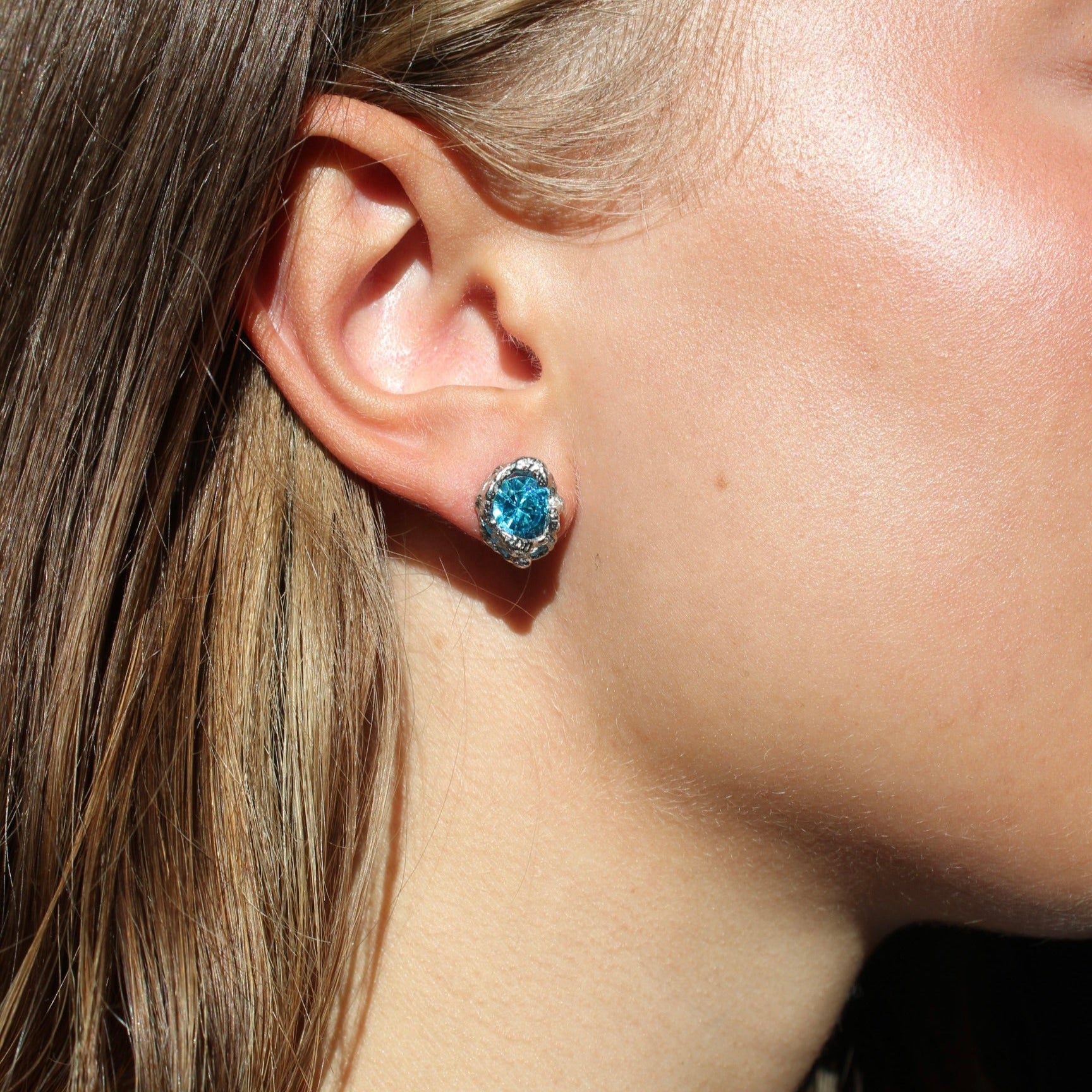Silver earrings with blue zirconia stone